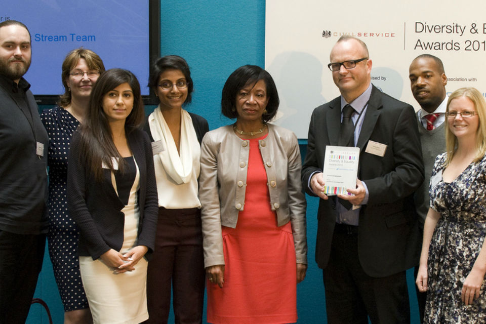 Claudette Sutton presents the Inclusive Employment award to the Civil Service Fast Stream Team at the 2013 Diversity and Equality Awards.
