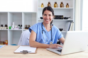 medical practitioner using laptop