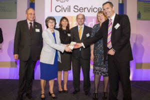 Dstl team being awarded the Skills Award by Bronwyn Hill at the Civil Service Awards 2014