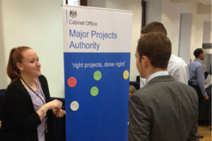 Civil servants talking at MPA stand 