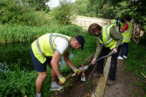 Civil servants from the South West working on a canal pathway project