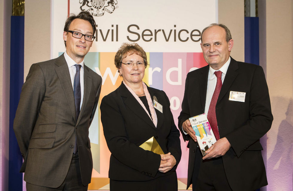 Richard receiving his award from Ursula Brennan, Perm Secretary MoJ