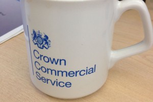 Close-up of a mug with the Crown Commercial Service logo on it