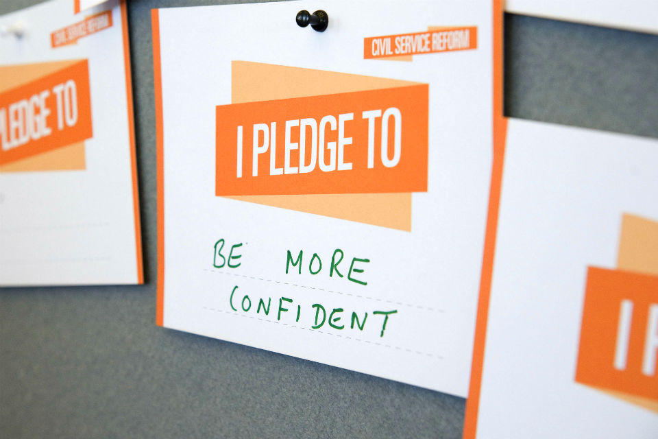 Pledge card at Civil Service Live 2014 London saying: "Be more confident"