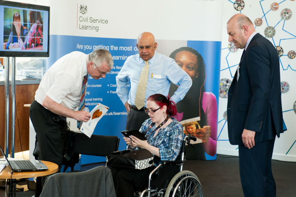 A photo of a disabled colleague at CS Learning's stand at Civil Service Live: Bristol 2014