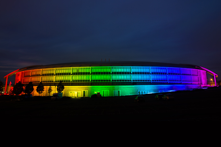 GCHQ lit up with the rainbow colour flag