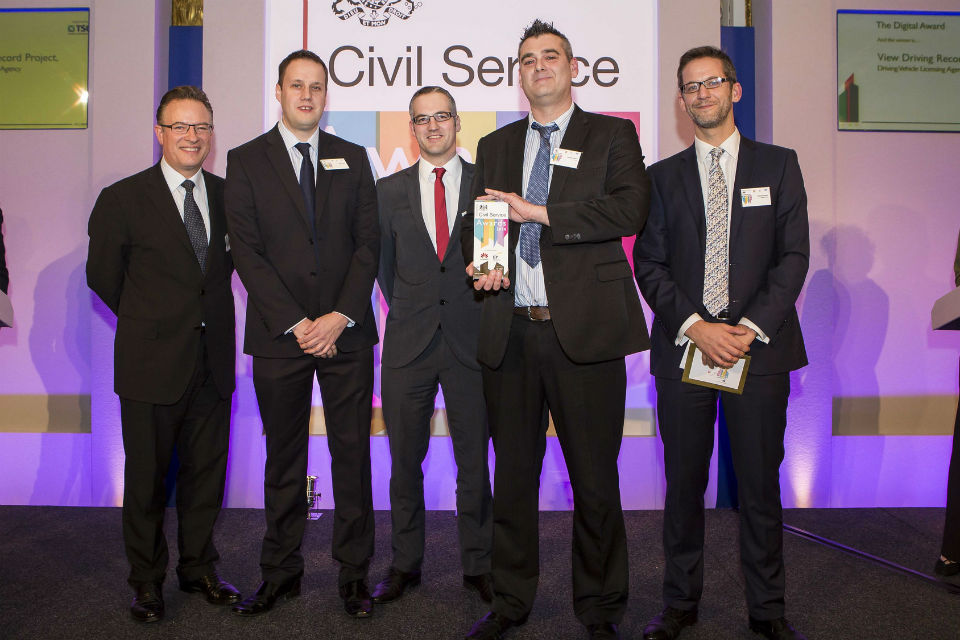 The DVLA digital team winning their Civil Service Award 2014, presented by Richard Heaton (right), Permanent Secretary for the Cabinet Office