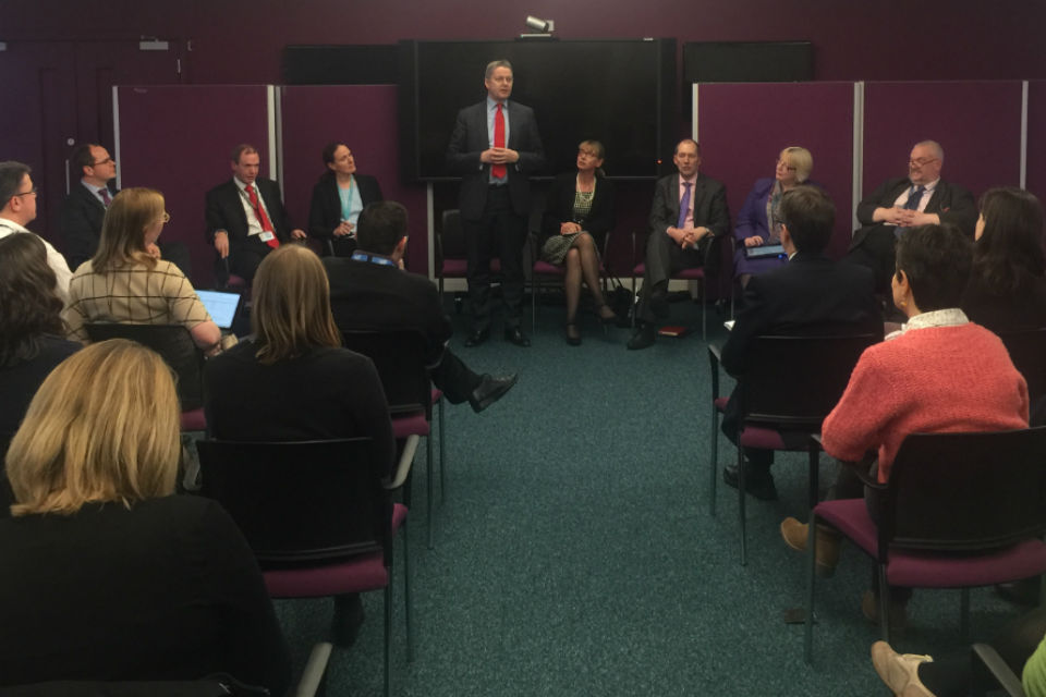 Jeremy Heywood standing and speaking to seated audience.