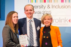 Two women and a man in front of Diversity & Inclusion Awards 2015 banner