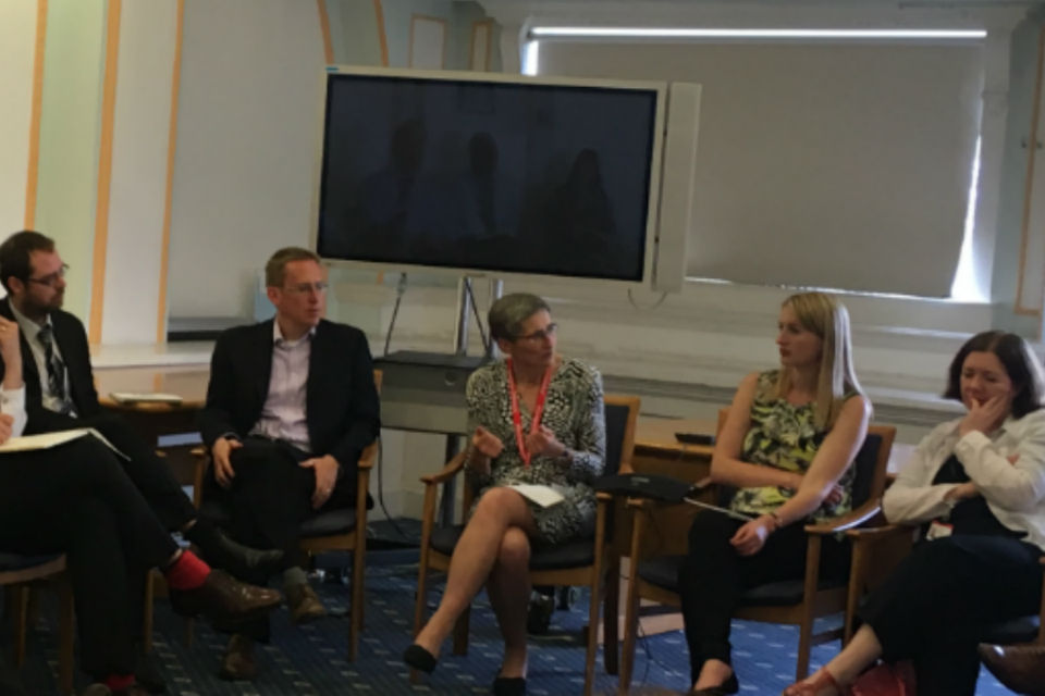 Seated group of men and women in conversation