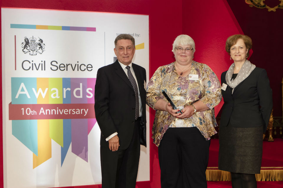 Liz Formby, centre of three, with CS Award