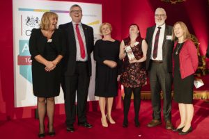 Group shot with award