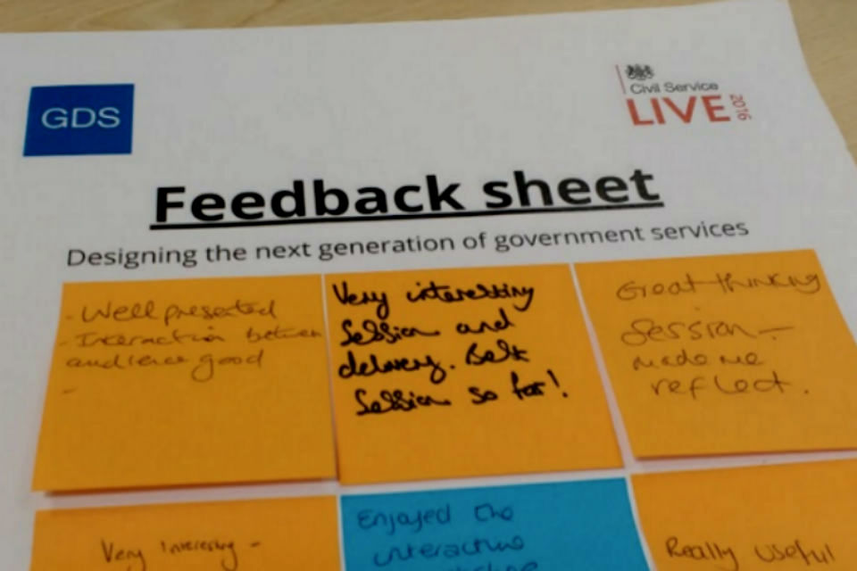 Feedback sheet with post-it notes with written comments on