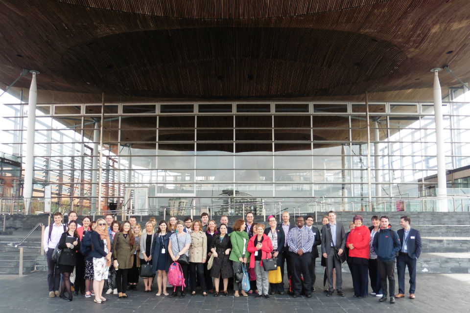 Group of men and women outside the Senedd, Cardiff