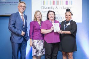 Katie (right) with her co-winner Joanne Bradley (2nd right) and the then Permanent Secretary of HMRC, Lin Homer (2nd left), and Chief Executive of Microlink, Dr Nasser Siabi (left).
