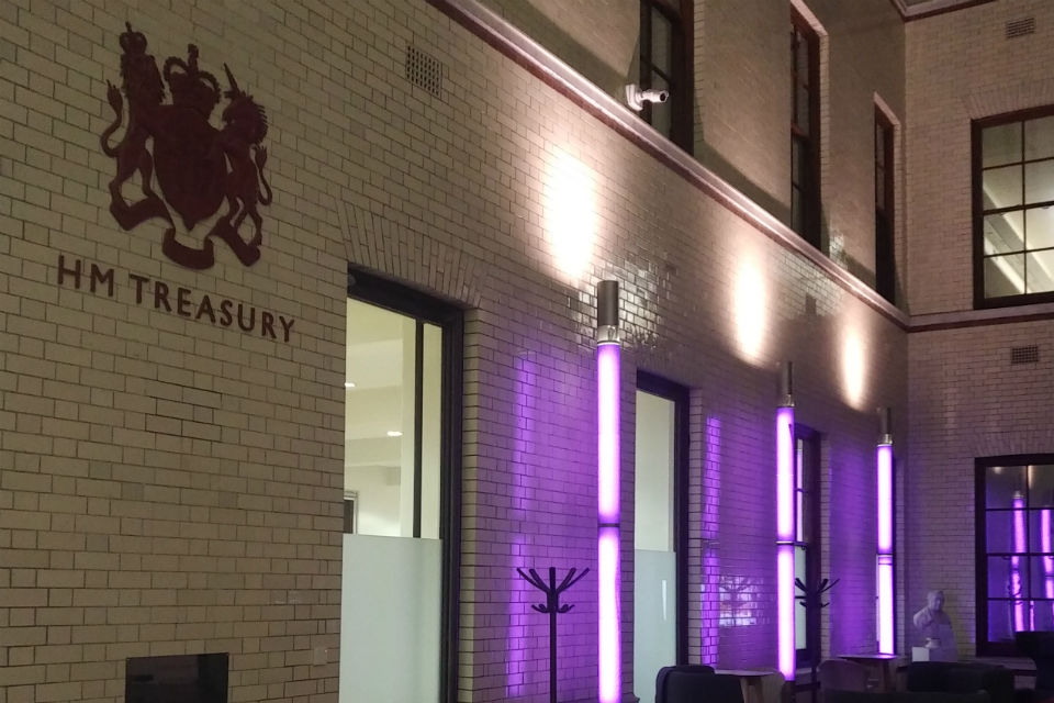 Government building exterior in purple light
