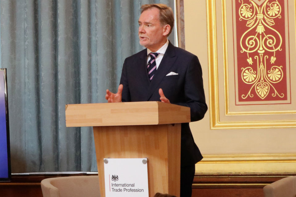 Man speaking at lectern