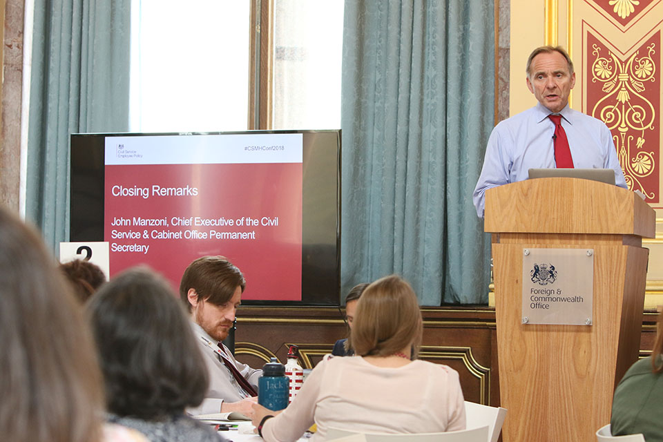 Man speaking at lectern