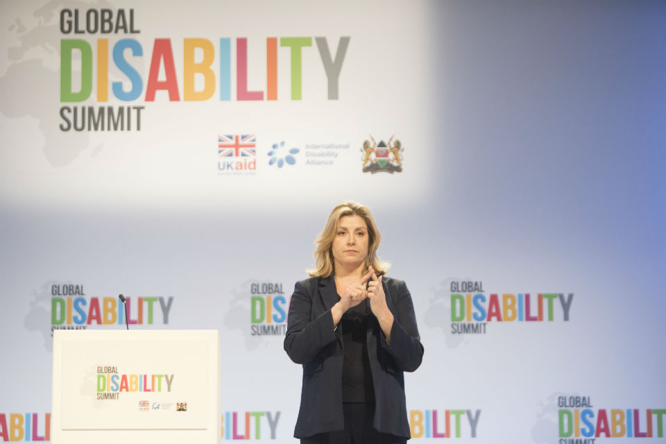 Woman speaking on conference stage