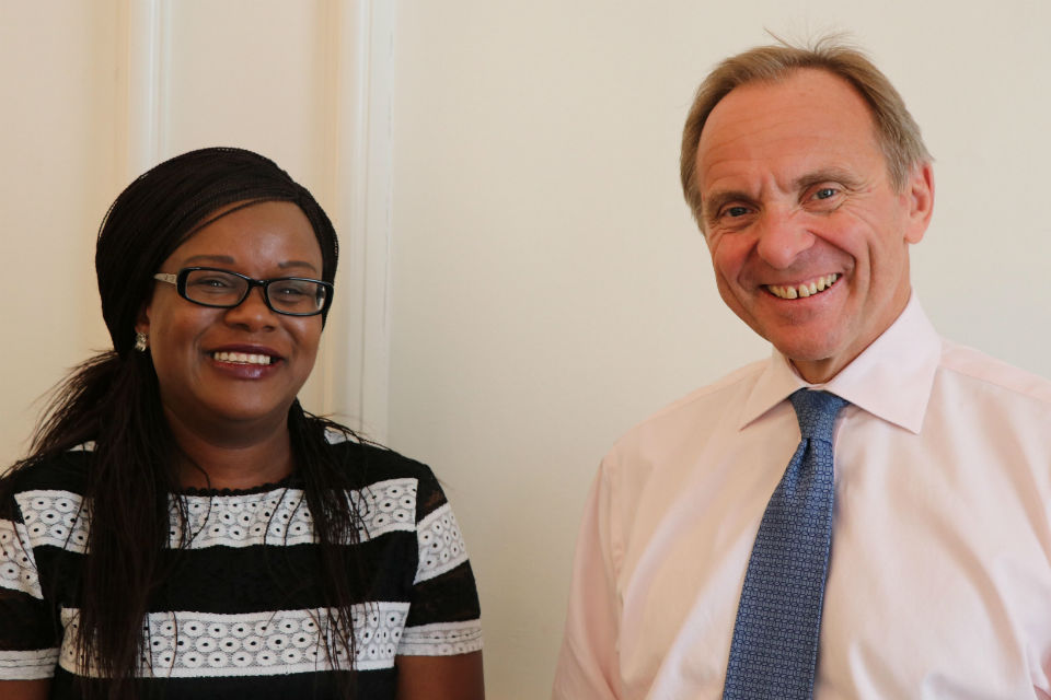 Bernadette Thompson and John Manzoni standing side by side, smiling to the camera.