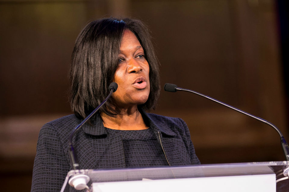 Jacky Wright speaking from a lectern at a conference