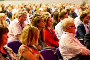 Audience of men and women at a Civil Service live event in London 2018.