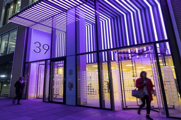 Victoria Street offices of the Department for Health & Social Care, illuminated in purple in support of the International Day of Persons with Disabilities