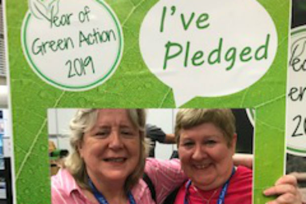 Two women framed by a Year of Green Action 2019 banner with the legend, 'I've pledged'