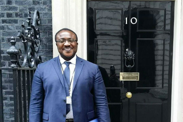 Augustine ('Austin') Entonu outside the door to No. 10 Downing Street