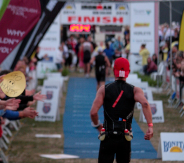 Michael approaching the finish line in an Ironman race