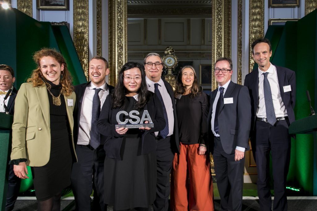 The MHCLG winners of the Innovation & Science Award, with award presenter Alex Chisholm, Permanent Secretary for the Department for Business, Energy and Industrial Strategy