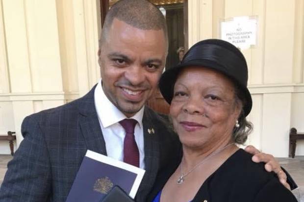 Rob Neil with his mother at Buckingham Palace after receiving his OBE