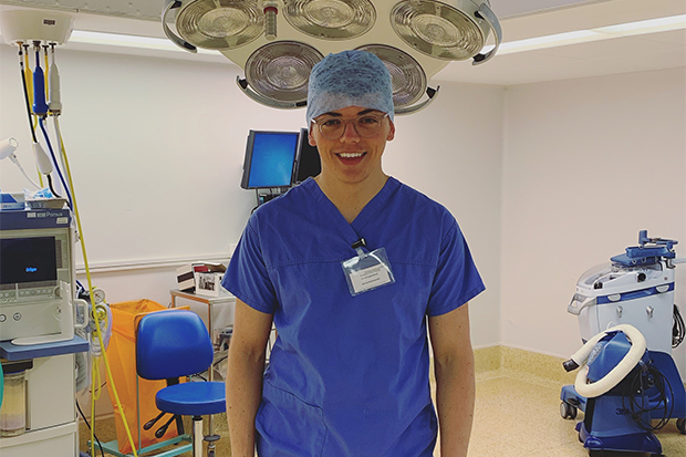 Henry Wadsworth in an operating theatre dressed in surgical scrubs