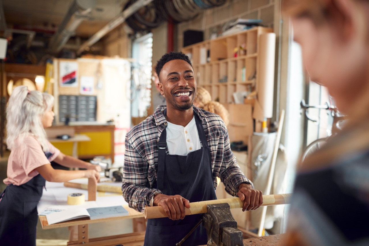 A young job seeker enrolled onto a woodworking course