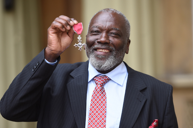 Joshua Johnson with his MBE following an investiture ceremony at Buckingham Palace, London.