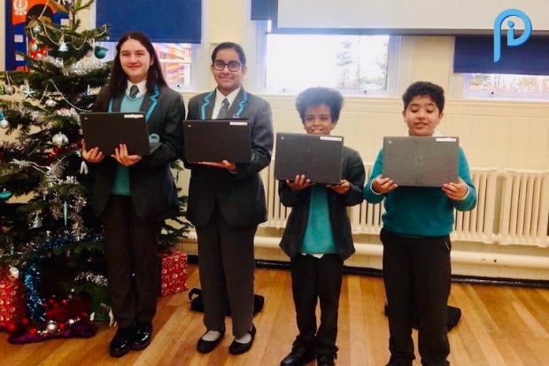 Children with Chromebook devices with Inside Policy logo