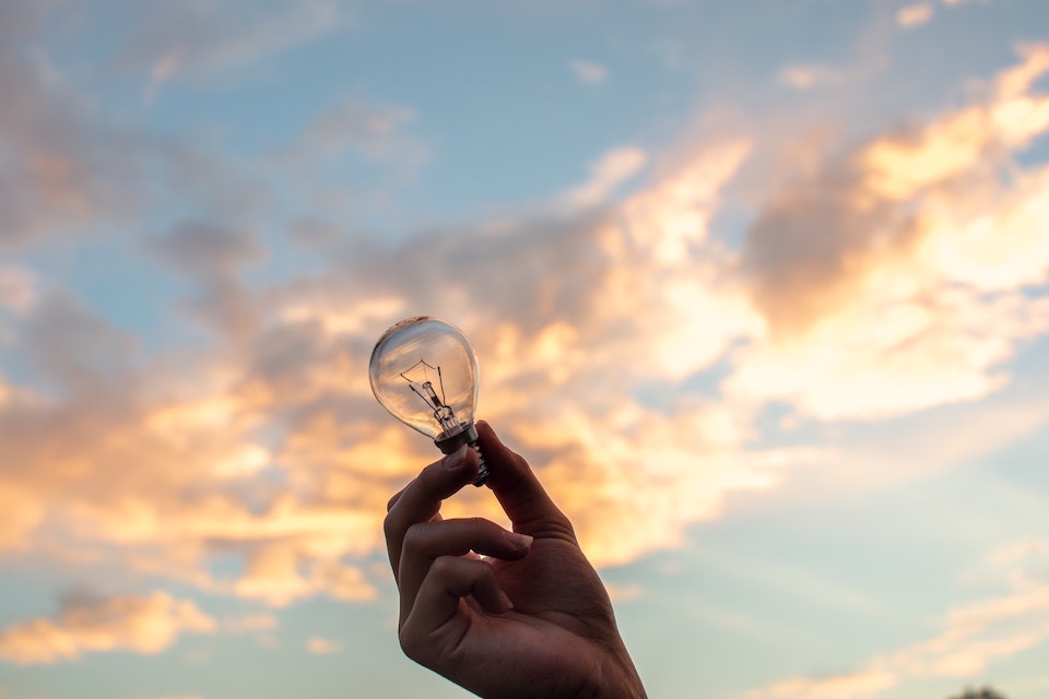 Picture of a lightbulb against a blue sky to depict concept of blue sky thinking