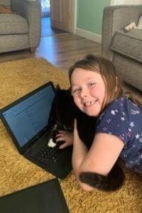 Pupil at Green Way Academy trying out her new laptop