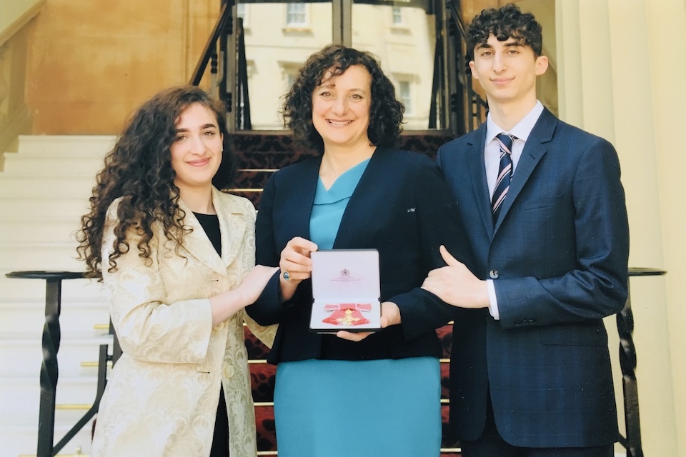 Stephanie Karpetas OBE receiving her honour at Buckingham Palace