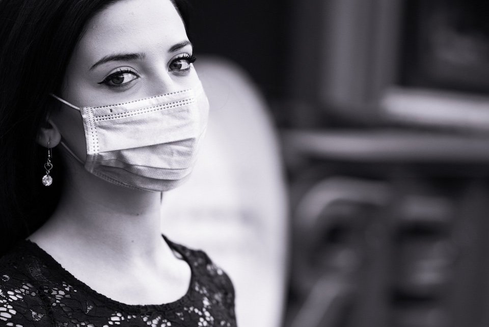 Image of a woman in a face mask