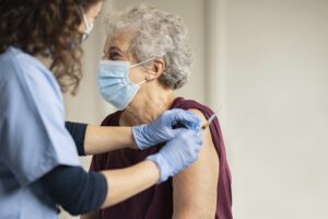 Elderly woman getting a Covid-19 vaccine