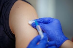 A woman receives a Covid-19 vaccine