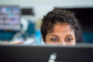 Image of a woman working at a computer