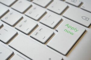 Image of a keyboard with Apply Now on a key