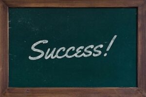 Image of blackboard depicting success