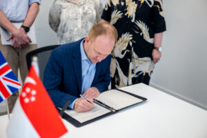 Tom Read, CEO of GDS signs the Memorandum of Understanding with Singapore