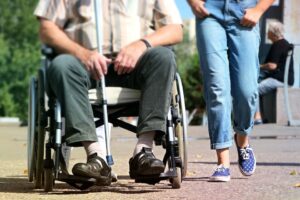 Wheelchair user with carer