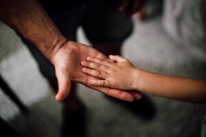 Clasping hands in a show of support